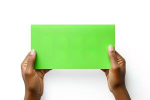 A human hand holding a blank sheet of green paper or card isolated on a white background. ai generated photo