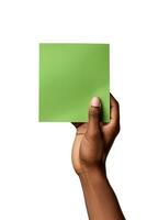 A human hand holding a blank sheet of green paper or card isolated on a white background. ai generated photo
