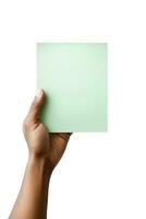 A human hand holding a blank sheet of green paper or card isolated on a white background. ai generated photo