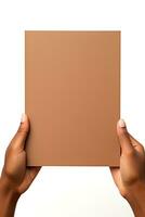 A human hand holding a blank sheet of brown paper or card isolated on a white background. ai generated photo