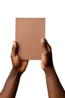 A human hand holding a blank sheet of brown paper or card isolated on a white background. ai generated photo