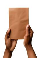 A human hand holding a blank sheet of brown paper or card isolated on a white background. ai generated photo