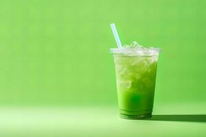 Green drink in a plastic cup isolated on a green background. Take away drinks concept with copy space. ai generated photo