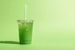 Green drink in a plastic cup isolated on a green background. Take away drinks concept with copy space. ai generated photo