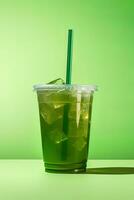 Green drink in a plastic cup isolated on a green background. Take away drinks concept. ai generated photo