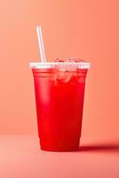 Red drink in a plastic cup isolated on a red pastel background. Take away drinks concept. ai generated photo