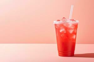 Red drink in a plastic cup isolated on a red pastel background. Take away drinks concept with copy space. ai generated photo