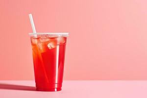 Red drink in a plastic cup isolated on a red pastel background. Take away drinks concept with copy space. ai generated photo