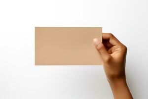 A human hand holding a blank sheet of beige paper or card isolated on a white background. ai generated photo