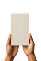 A human hand holding a blank sheet of beige paper or card isolated on a white background. ai generated photo