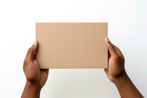 A human hand holding a blank sheet of beige paper or card isolated on a white background. ai generated photo