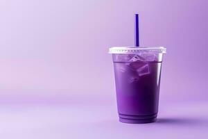 Purple drink in a plastic cup isolated on a purple background. Take away drinks concept with copy space. ai generated photo