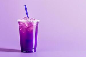 Purple drink in a plastic cup isolated on a purple background. Take away drinks concept with copy space. ai generated photo