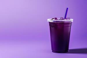 Purple drink in a plastic cup isolated on a purple background. Take away drinks concept with copy space. ai generated photo