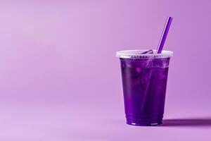 Purple drink in a plastic cup isolated on a purple background. Take away drinks concept with copy space. ai generated photo