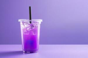 Purple drink in a plastic cup isolated on a purple background. Take away drinks concept with copy space. ai generated photo