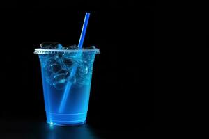 Blue drink in a plastic cup isolated on a black background. Take away drinks concept with copy space. ai generated photo