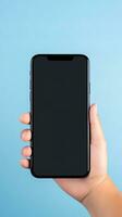 Hand holding smartphone with a black blank screen isolated on a blue background. ai generated photo