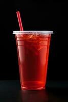 Red drink in a plastic cup isolated on a black background. Take away drinks concept. ai generated photo