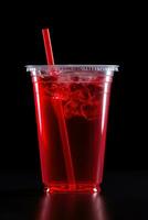 Red drink in a plastic cup isolated on a black background. Take away drinks concept. ai generated photo