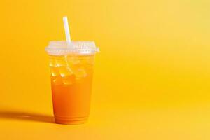 Orange color drink in a plastic cup isolated on a orange color background. Take away drinks concept with copy space. ai generated photo