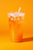 Orange color drink in a plastic cup isolated on a orange color background. Take away drinks concept. ai generated photo