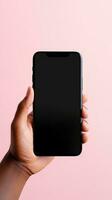 Hand holding smartphone with a black blank screen isolated on a pink background. ai generated photo
