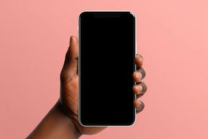 Hand holding smartphone with a black blank screen isolated on a pink background. ai generated photo