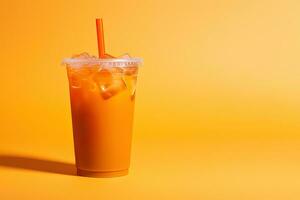 Orange color drink in a plastic cup isolated on a orange color background. Take away drinks concept with copy space. ai generated photo