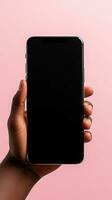 Hand holding smartphone with a black blank screen isolated on a pink background. ai generated photo