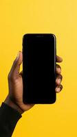 Hand holding smartphone with a black blank screen isolated on a yellow background. ai generated photo