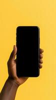 Hand holding smartphone with a black blank screen isolated on a yellow background. ai generated photo