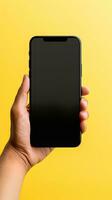 Hand holding smartphone with a black blank screen isolated on a yellow background. ai generated photo