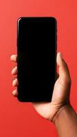 Hand holding smartphone with a black blank screen isolated on a red background. ai generated photo