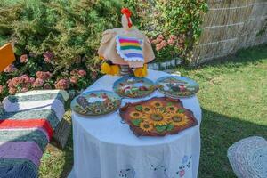 Painted plates on the table photo