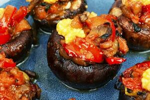 Plate with delicious stuffed mushrooms photo