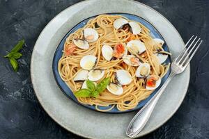 Pasta with fried clams. photo