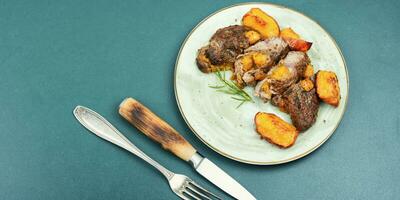 Juicy meat steak with peach. photo