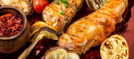 Grilled salmon on skewer photo