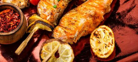 Grilled salmon on skewer photo