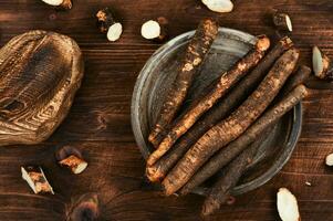 Raw salsify in herbal medicine, salsify roots. photo