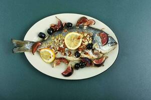 Tasty roasted dorado or gilt head bream fish photo