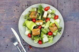 Salad with fresh vegetables and tofu. photo