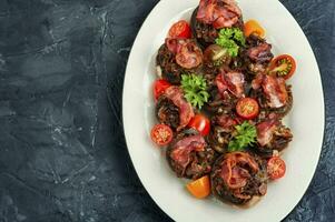 Baked stuffed mushroom caps. photo