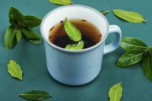 Bay leaf herbal tea in mug photo