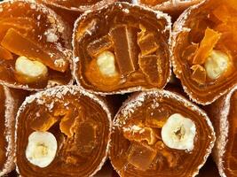 Traditional Turkish sweets, slices of turkish delight close up view photo