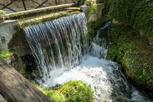 Rasiglia, a village with streams and waterfalls in the middle photo