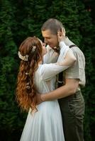 wedding walk of the bride and groom in a coniferous photo