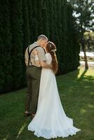 wedding walk of the bride and groom in a coniferous photo