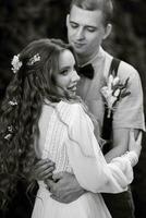 wedding walk of the bride and groom in a coniferous photo